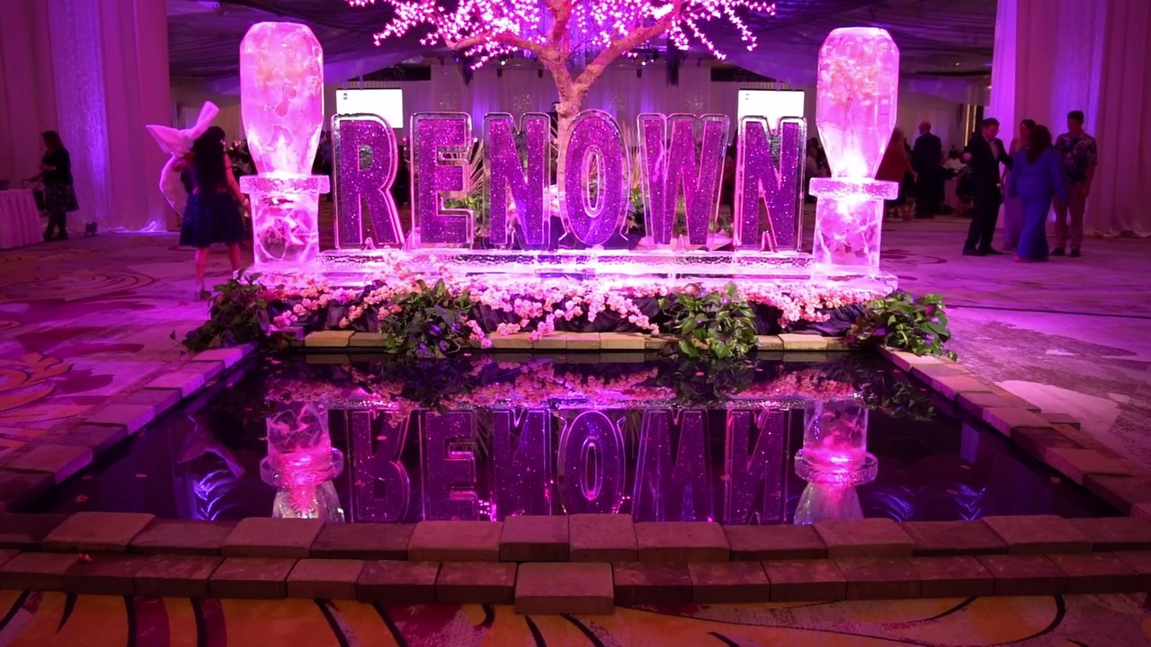 The RENOWN ice sculpture lit up in purple at Celebrate Amazing
