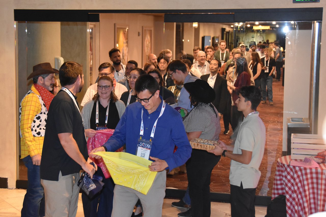 Guests lining up at the door for bandanas at the SciX Gala