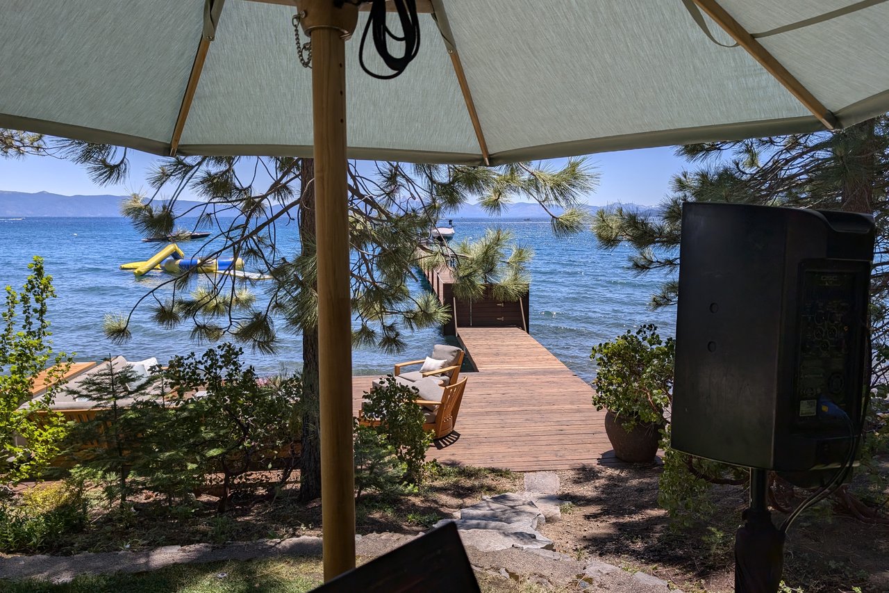 The dock and Lake Tahoe seen from under the DJ booth umbrella