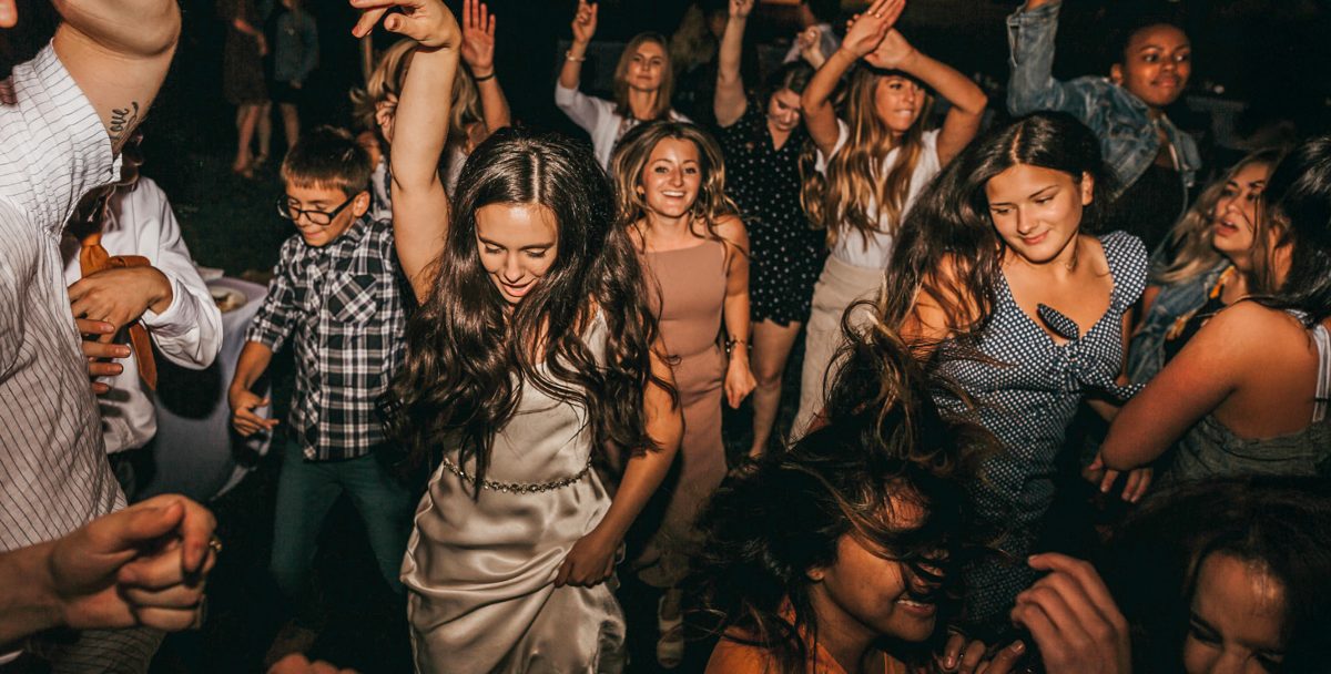 A packed dance floor of celebrating guests at a Reno wedding reception