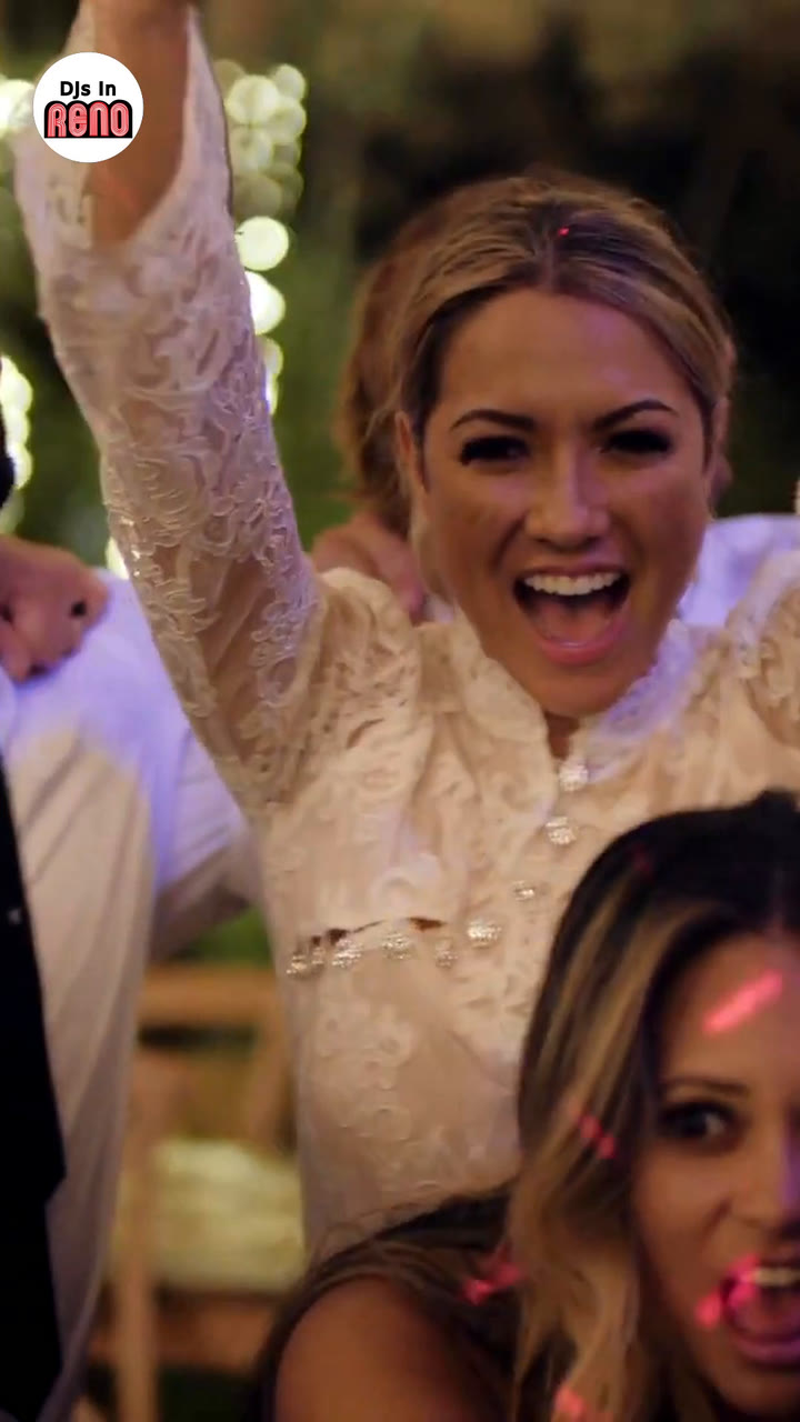 Joan dancing with her arms up among her guests at her wedding, the first frame of the DJs In Reno sizzle reel