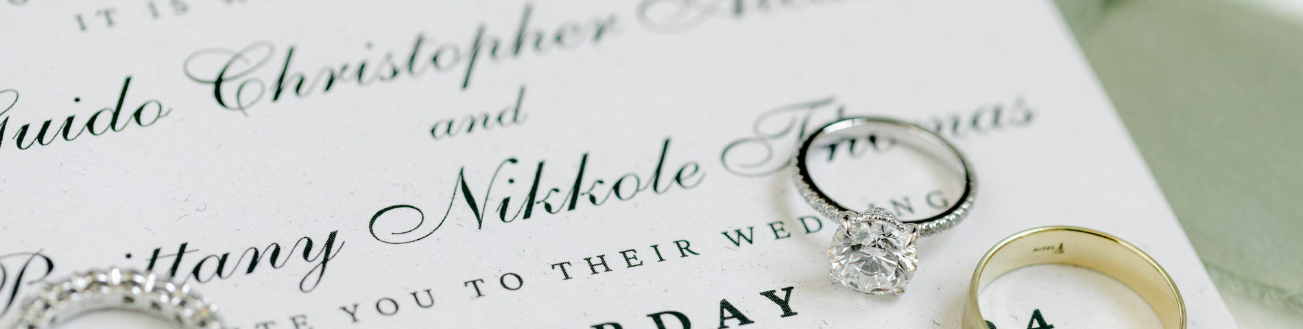 Elegant wedding rings on invitation - Book your Reno wedding DJ today