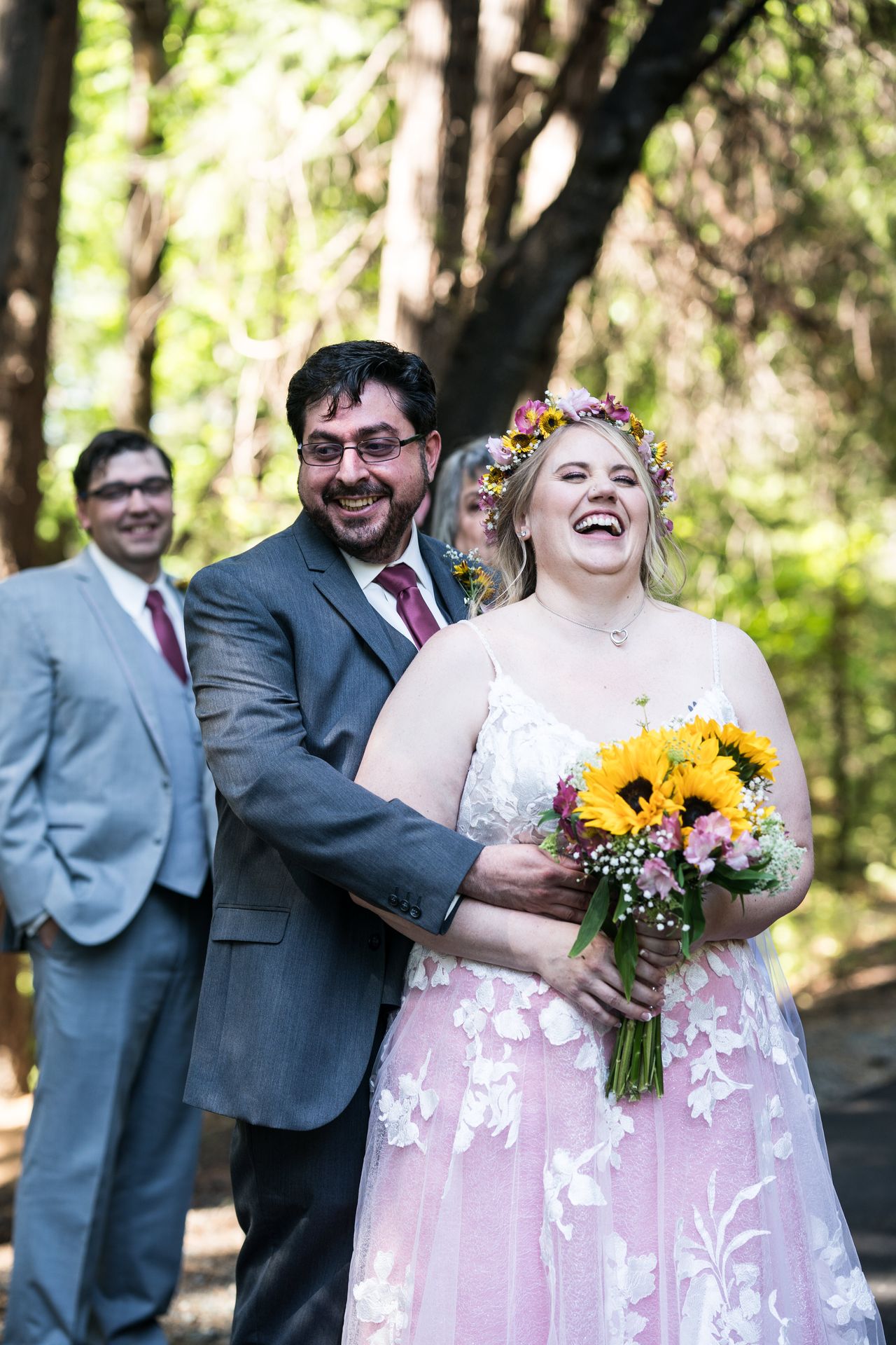 Chris hugs Abney from behind while she laughs out loud
