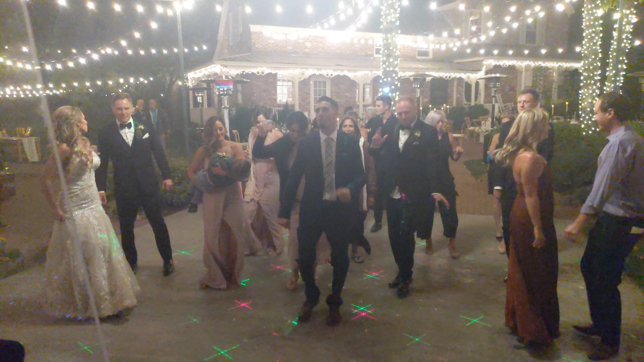 Angela and her guests dance under the string lights at Twenty Mile House