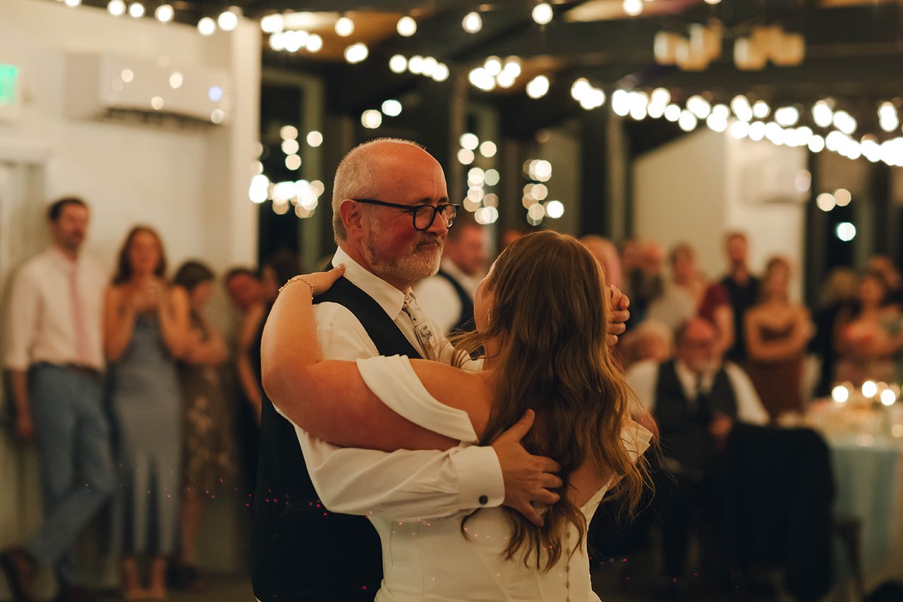 Autumn dances the father daughter dance while guests watch