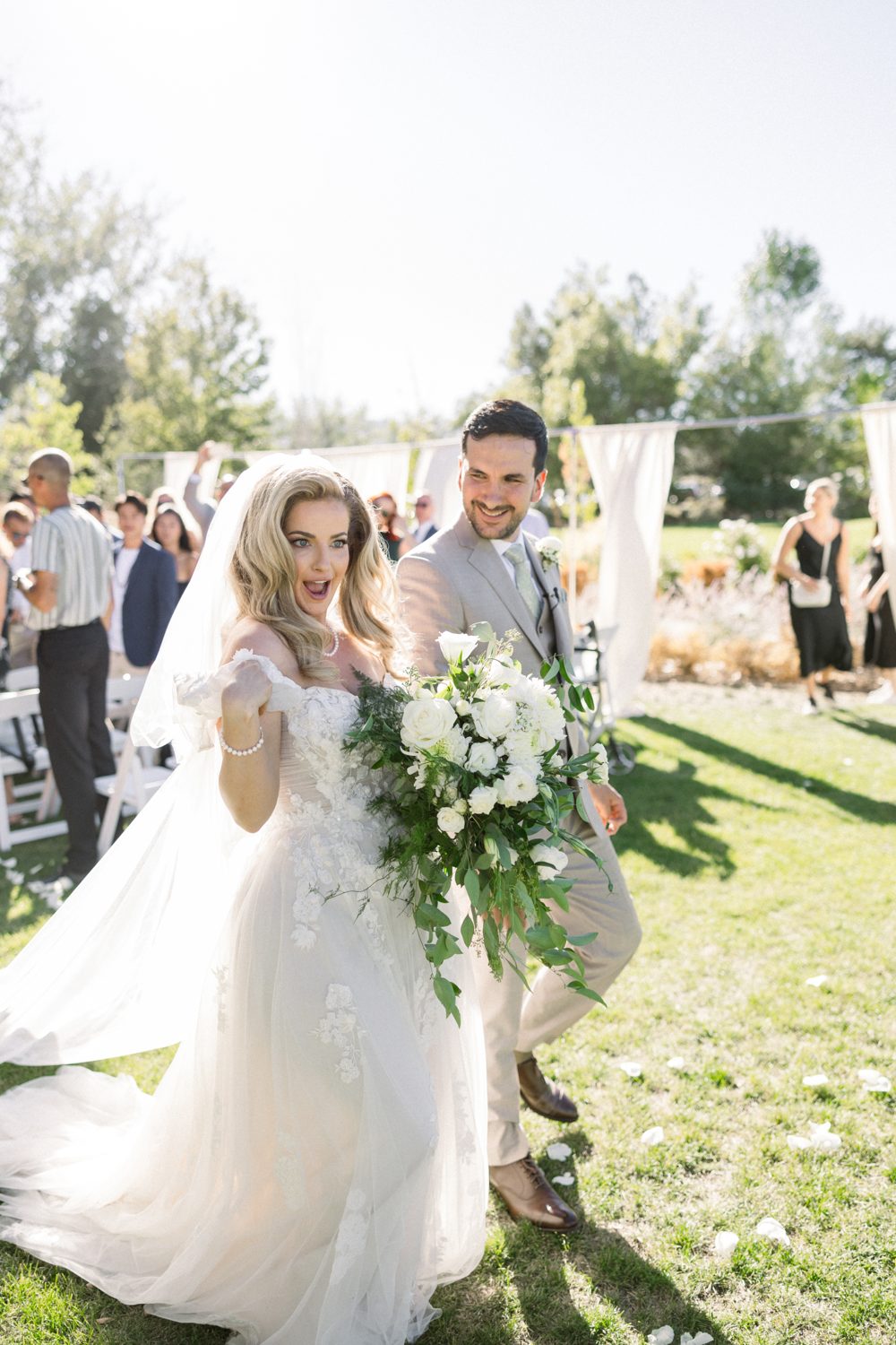 Britt points to the camera as she and Chris celebrate after their ceremony