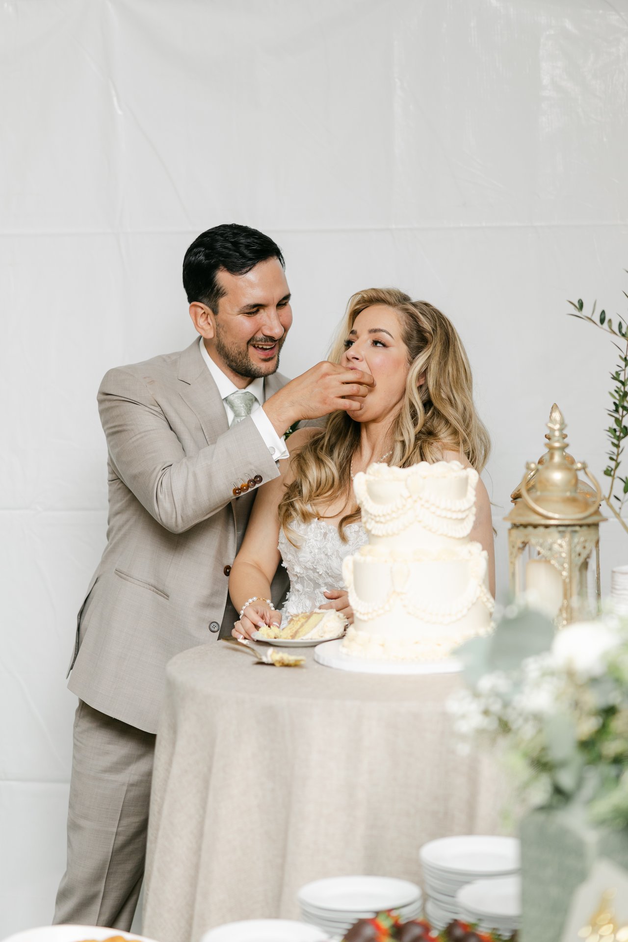 Chris feeds Britt a bite of cake