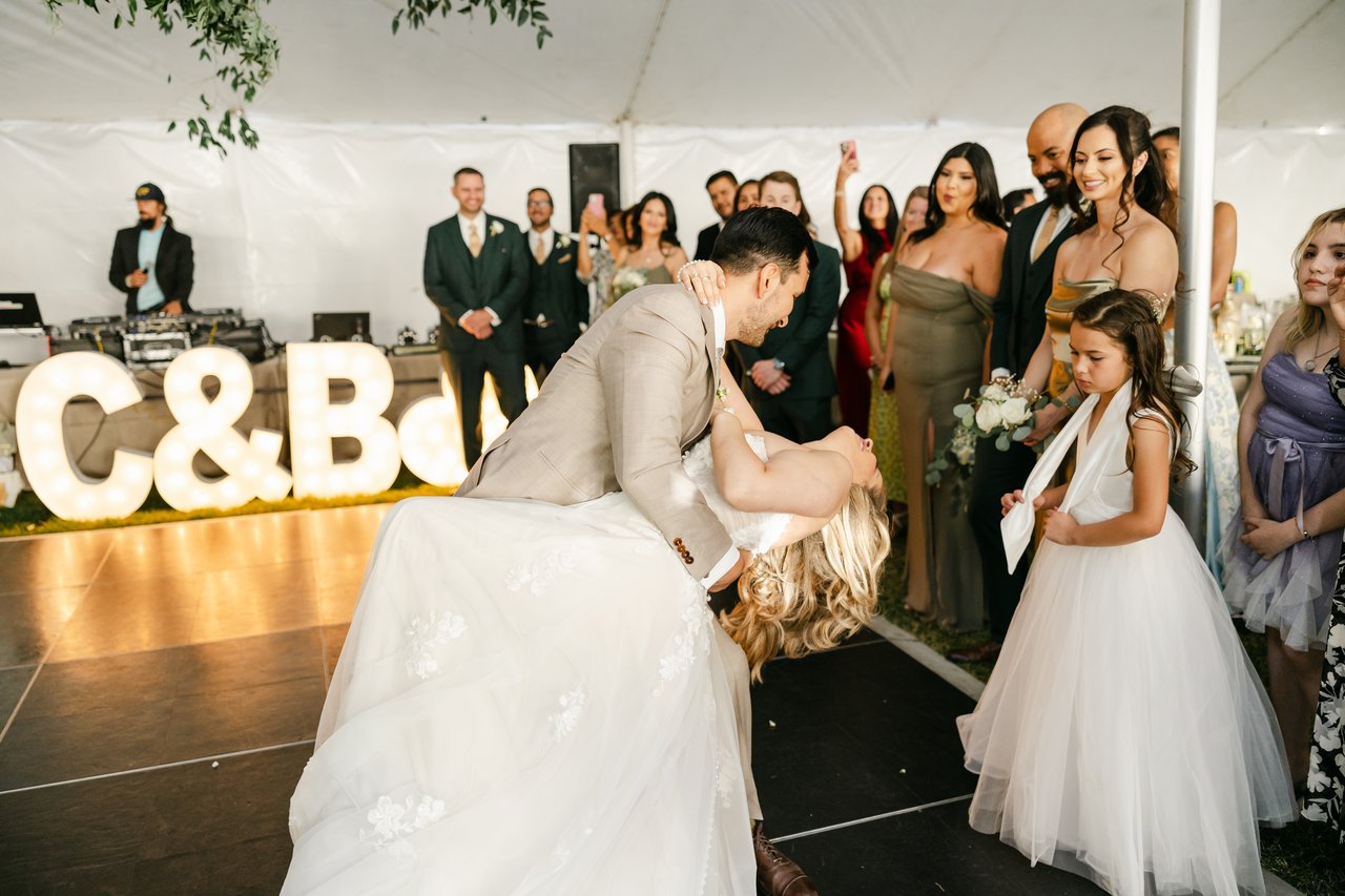 Chris dips Britt to finish their first dance