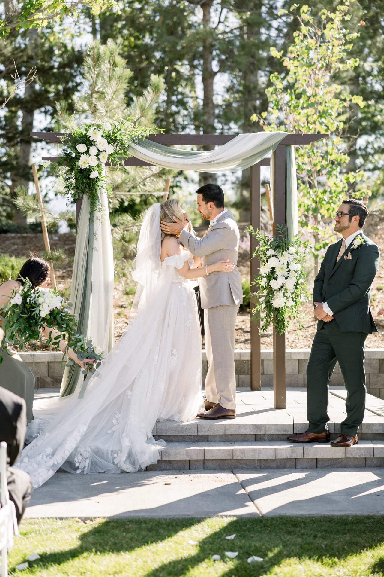 Britt and Chris share their first kiss under the arbor