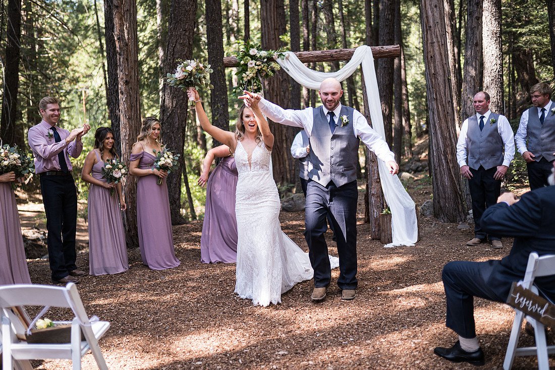 Arms up after being pronounced married
