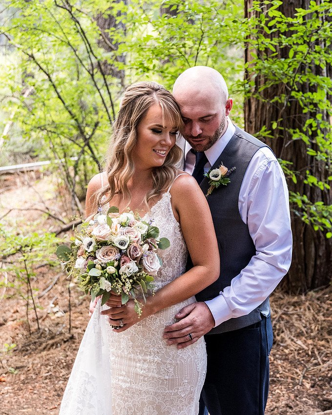 Couple embrace in the forest
