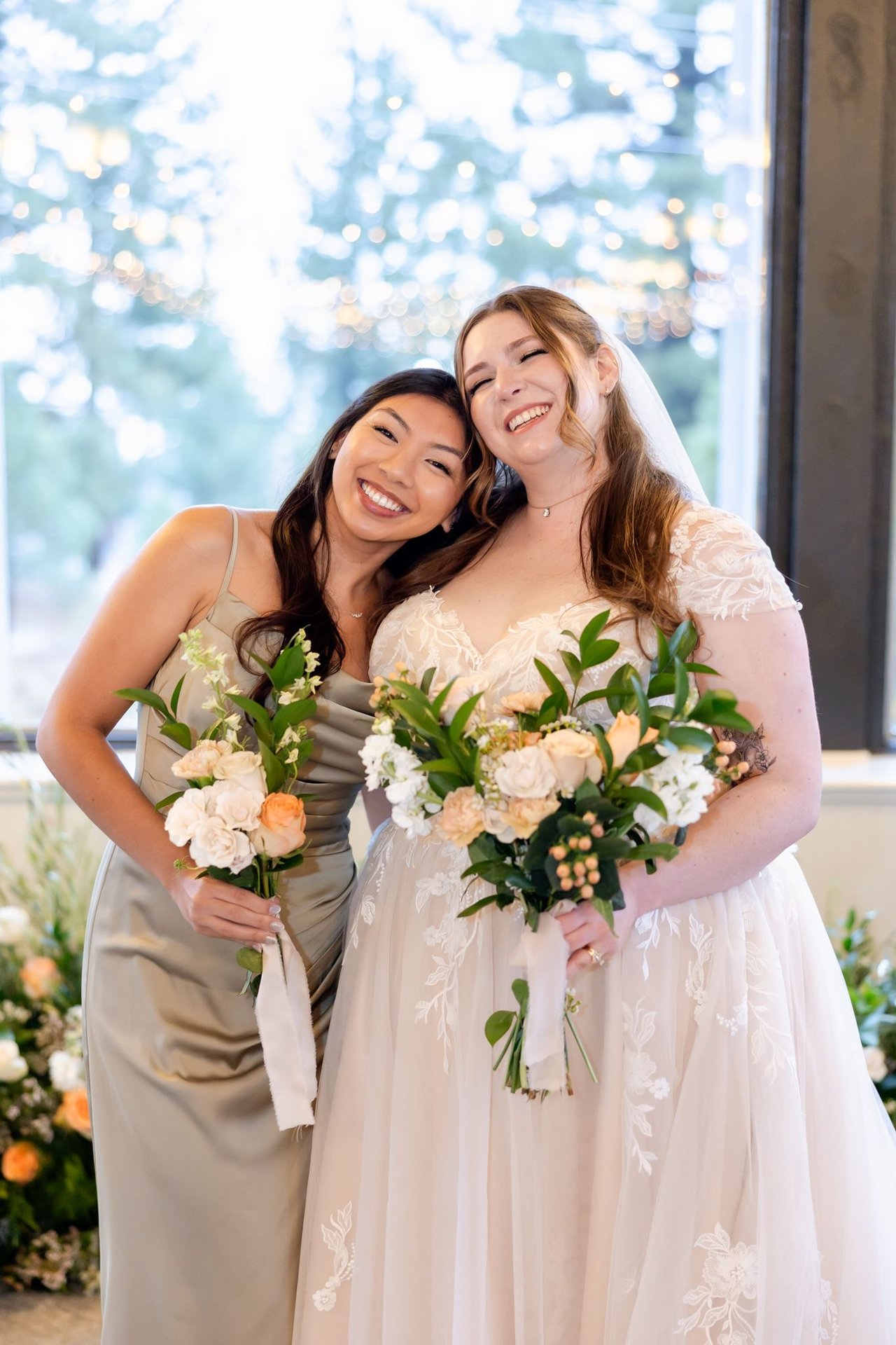 A bridesmaid leans her head on Danielle's shoulder