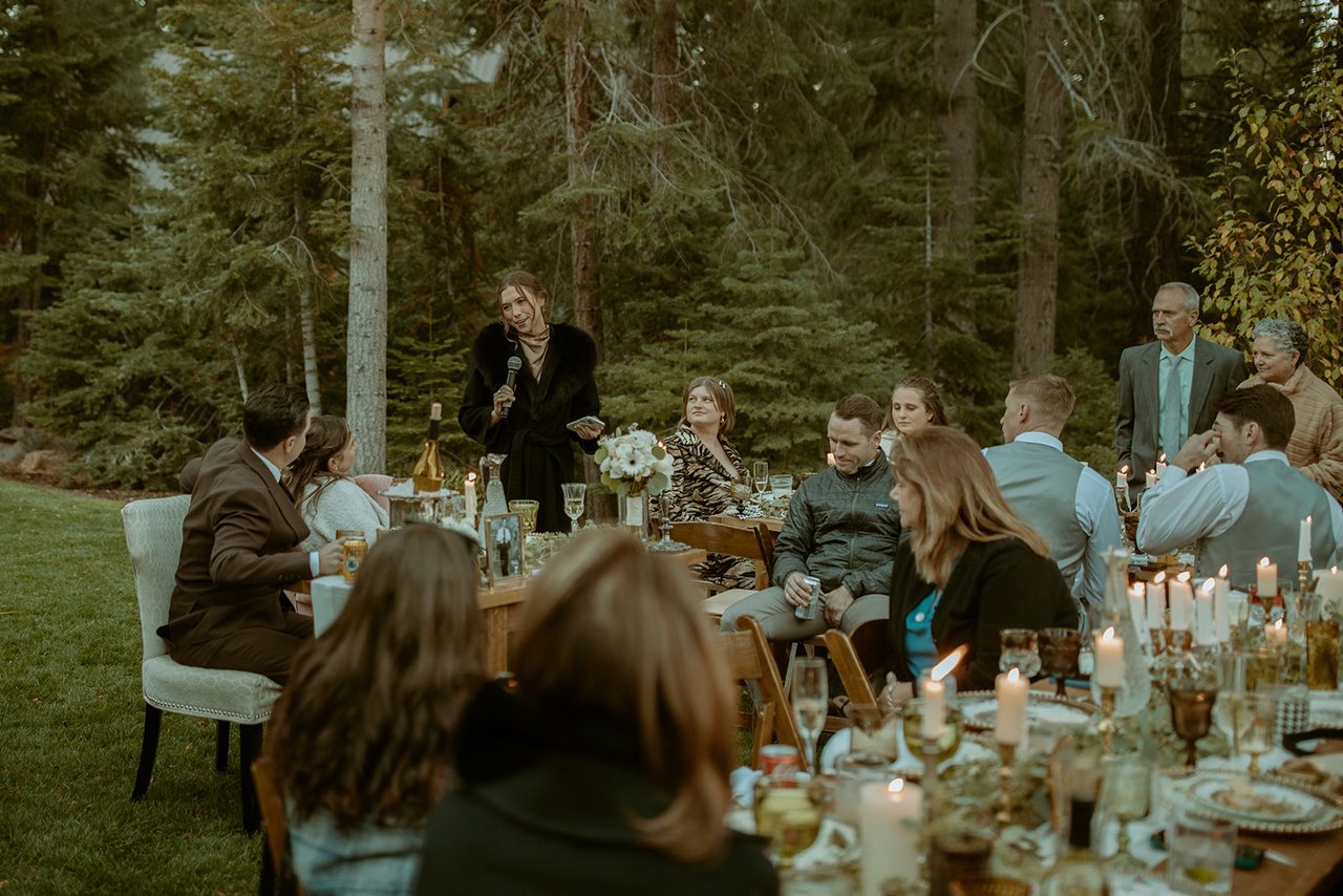 The maid of honor gives her speech to the tables