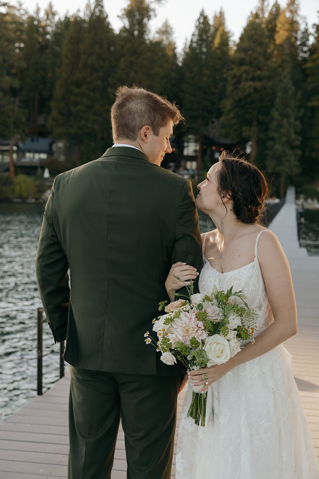Emma kisses Jackson on the cheek on the dock
