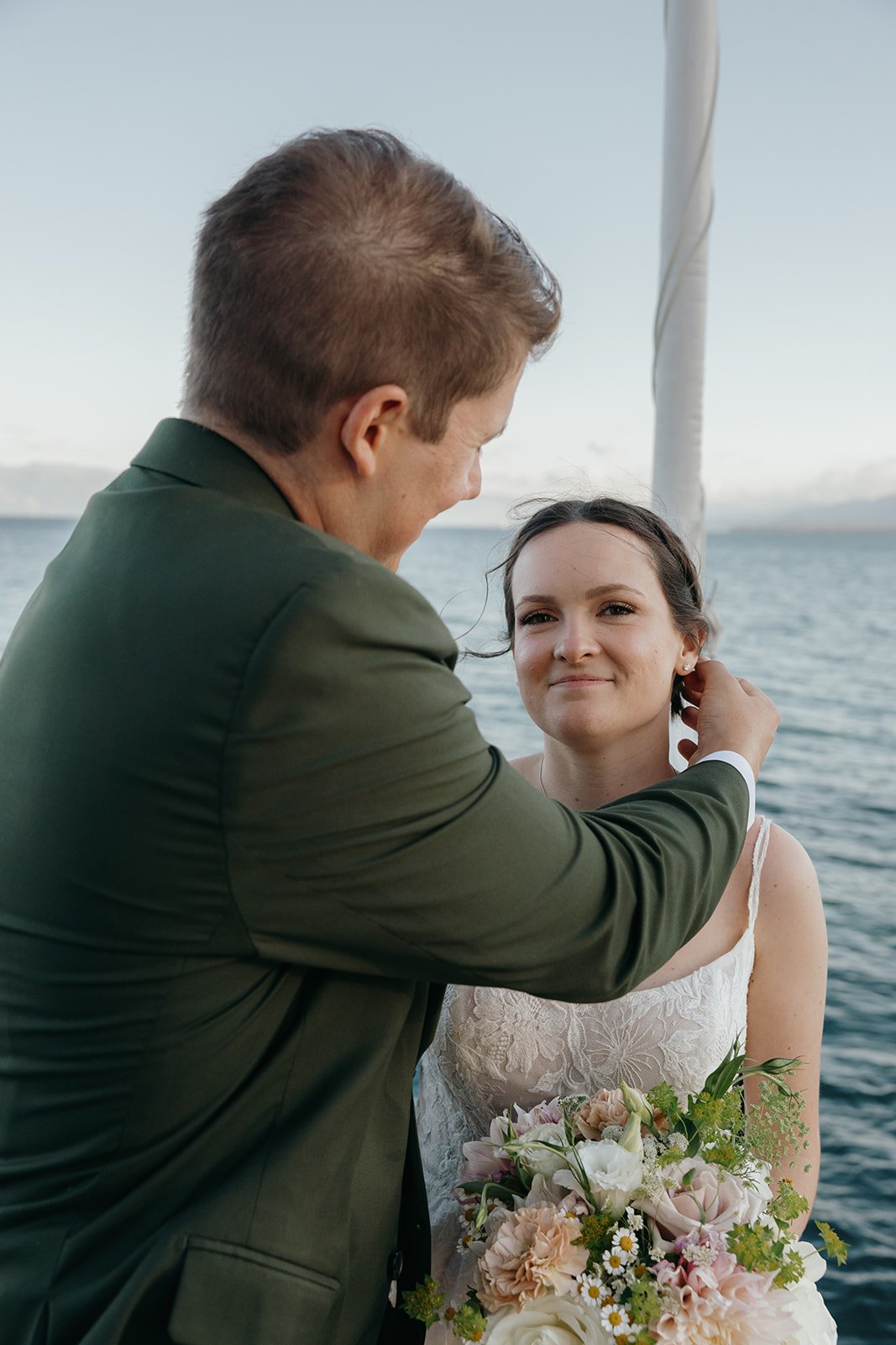 Jackson tucks a strand of hair behind Emma's ear as she smiles up at him