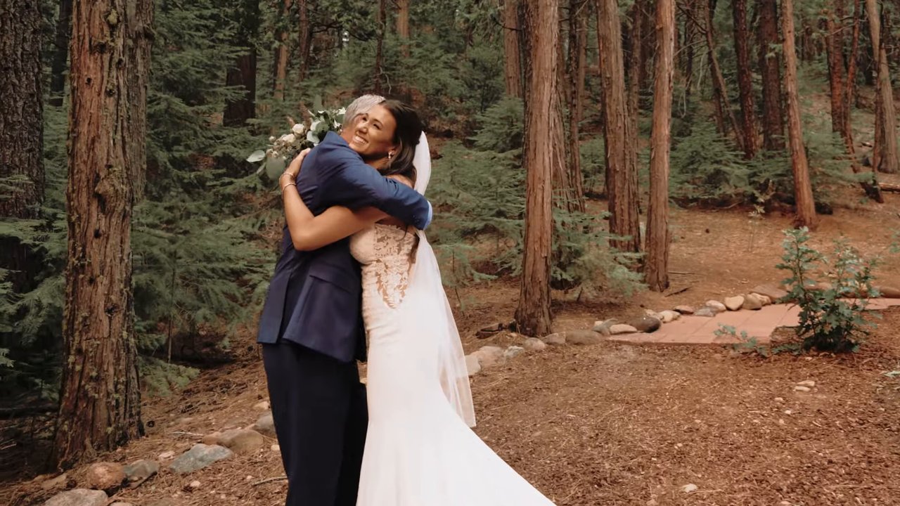 Jen hugs her dad after their first look in the pines