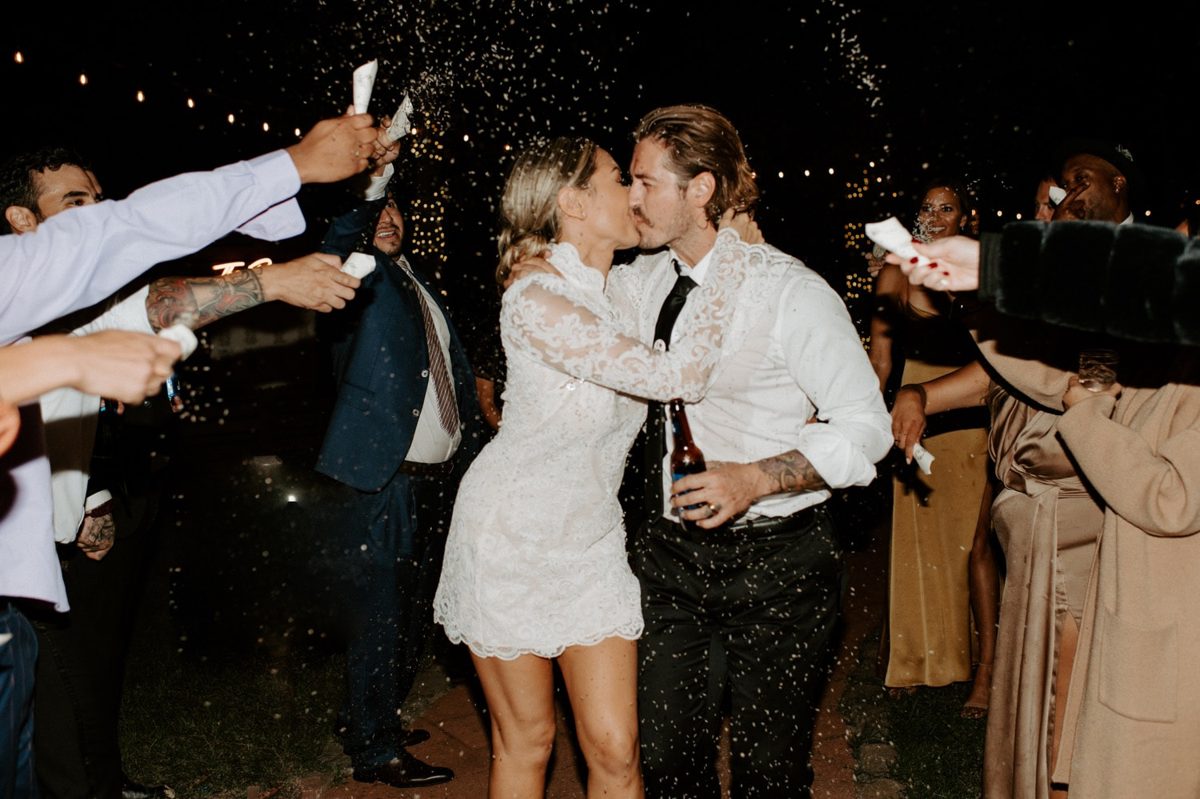 Joan and Kyle kiss during their champagne soaked nighttime sendoff