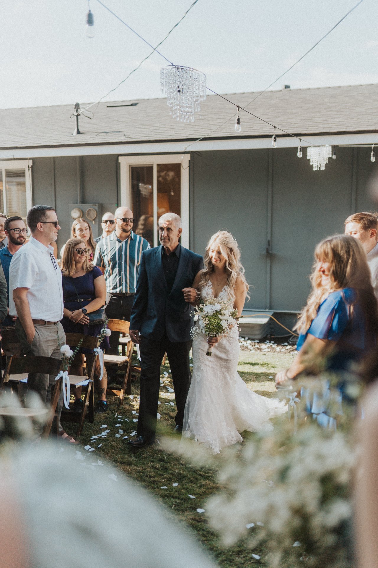Lexy and her dad start down the aisle