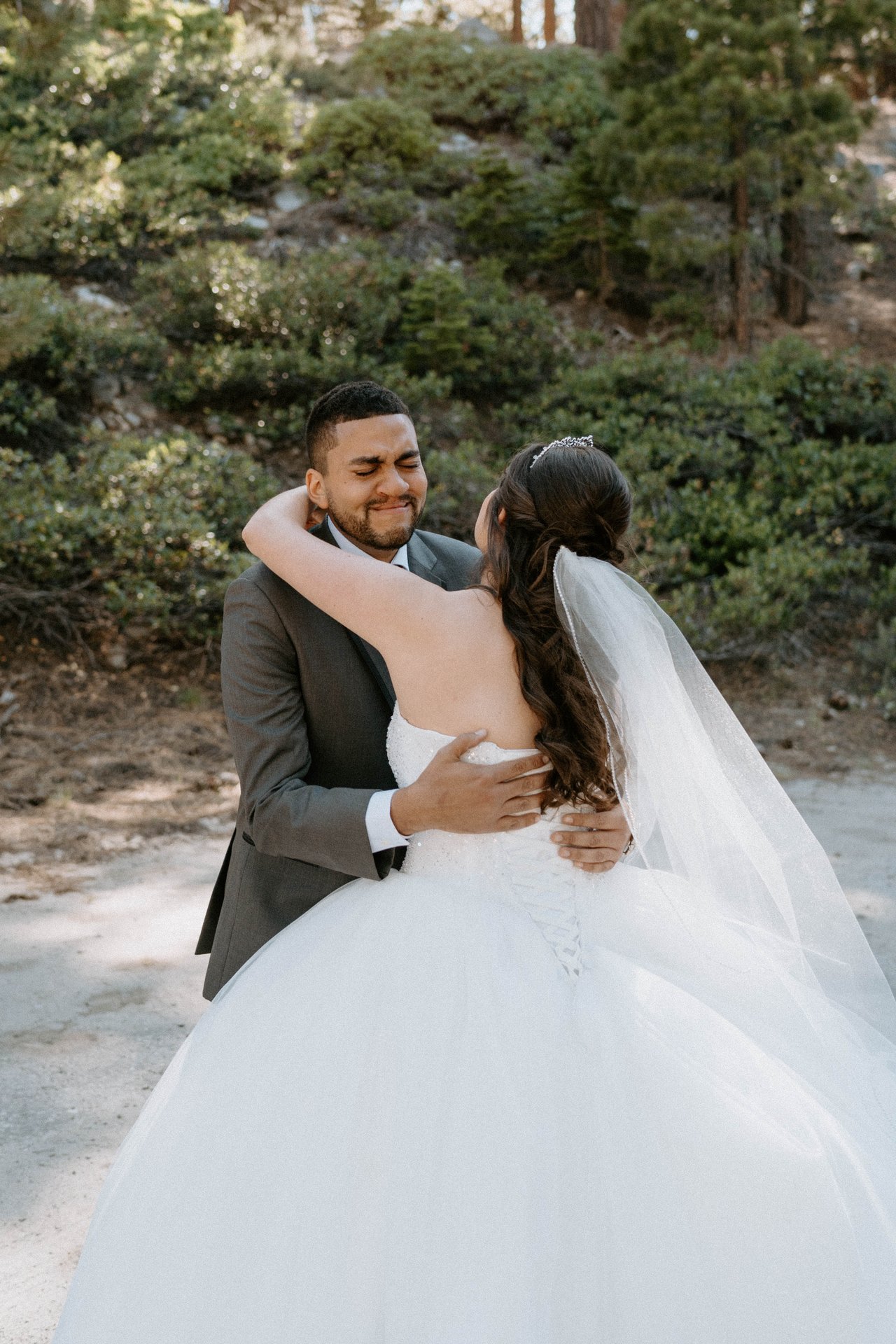 Jason laughs as he wraps Montse in a hug at their first look