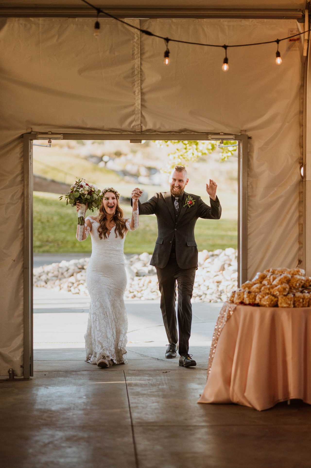 Rachel and Christopher make their grand entrance into the tent