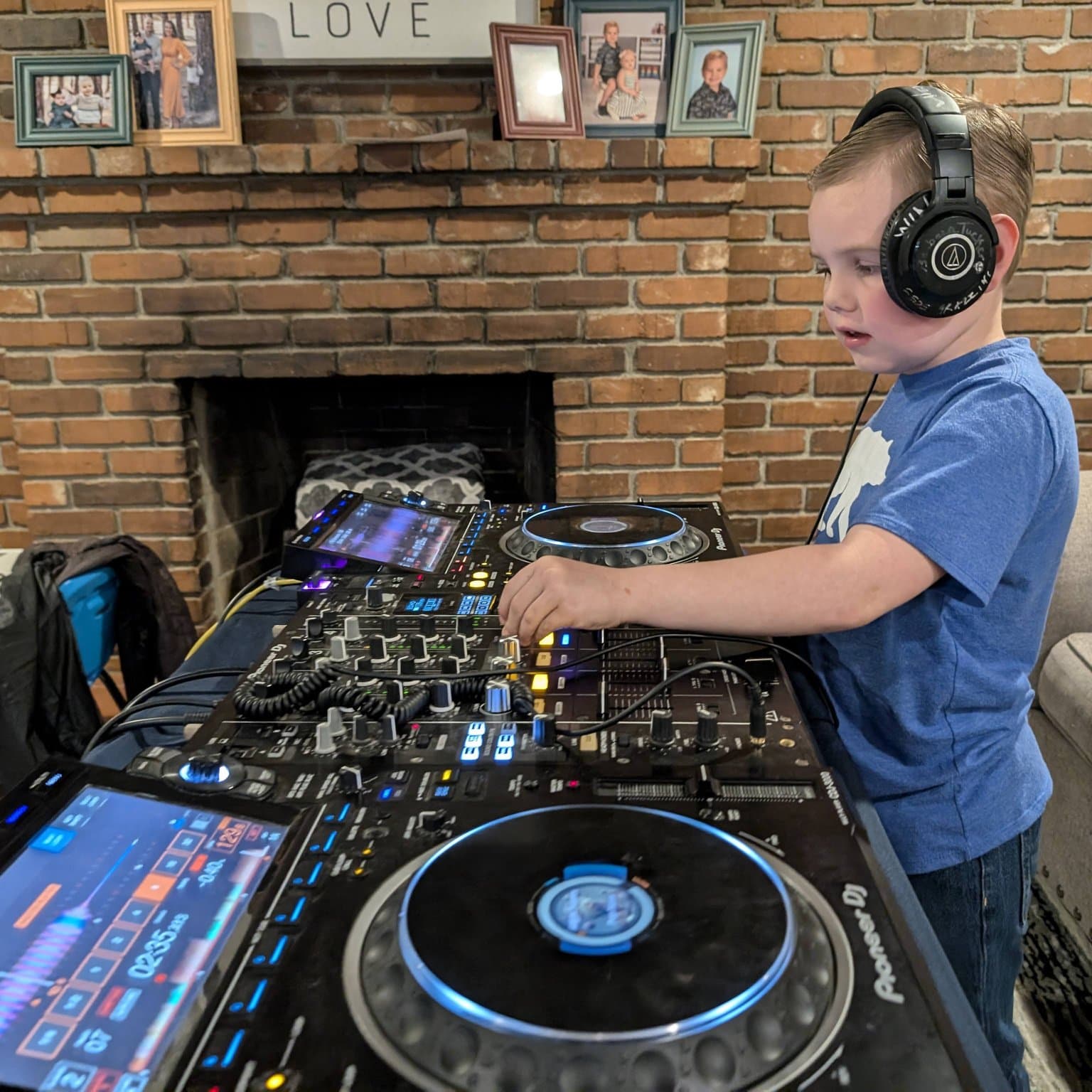 Student learning DJ techniques with professional equipment